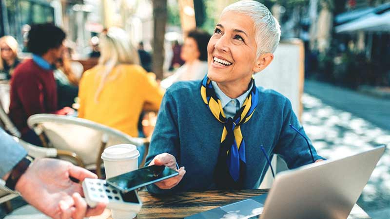 woman paying contactless on restaurant